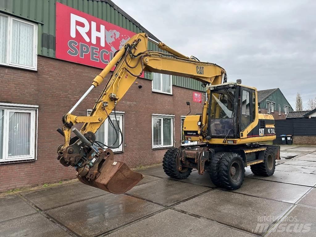 CAT M315 +ROTO CE Wheeled excavators